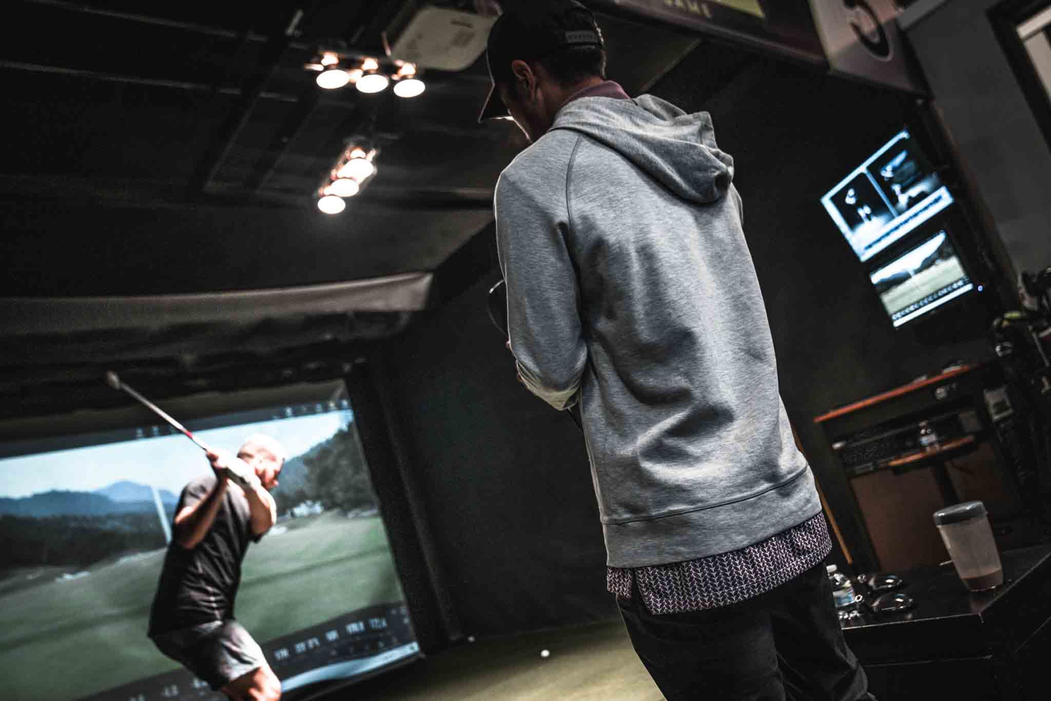 A picture of golfer investing in their game with a Tee Box club fitting.